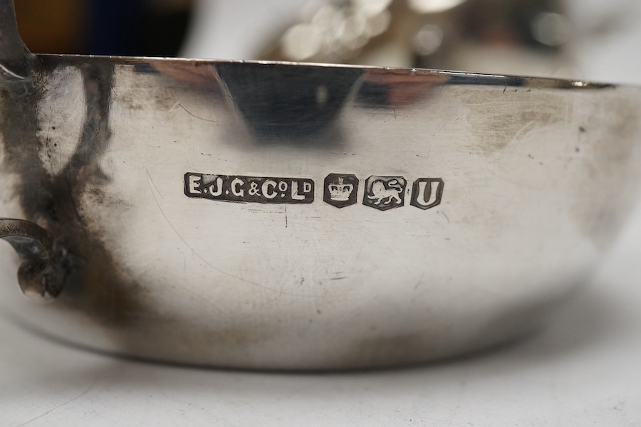 A silver quaich, E J Gallichan & Co Ltd, Sheffield, 1962, diameter 10.2cm, together with a silver sauceboat and a small silver dish, 10.1oz. Condition - fair